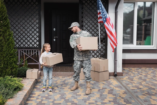 A veteran family moving into a new home, symbolizing the stability and security provided by housing assistance programs.