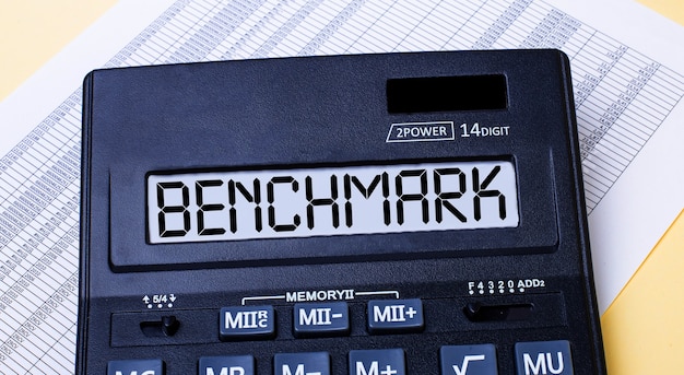 A close-up image of a calculator with the CPI-W index displayed on a nearby computer screen, symbolizing the calculation and determination of the COLA increase for retirement benefits.