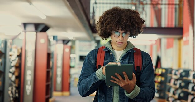 A student happily browsing through a digital textbook on a tablet, with annotations and highlighting visible, showcasing the convenience and cost-effectiveness of digital textbooks.