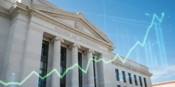 Federal Reserve building with financial charts in background